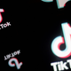The TikTok is shown spread out and inverted four times against a black background.